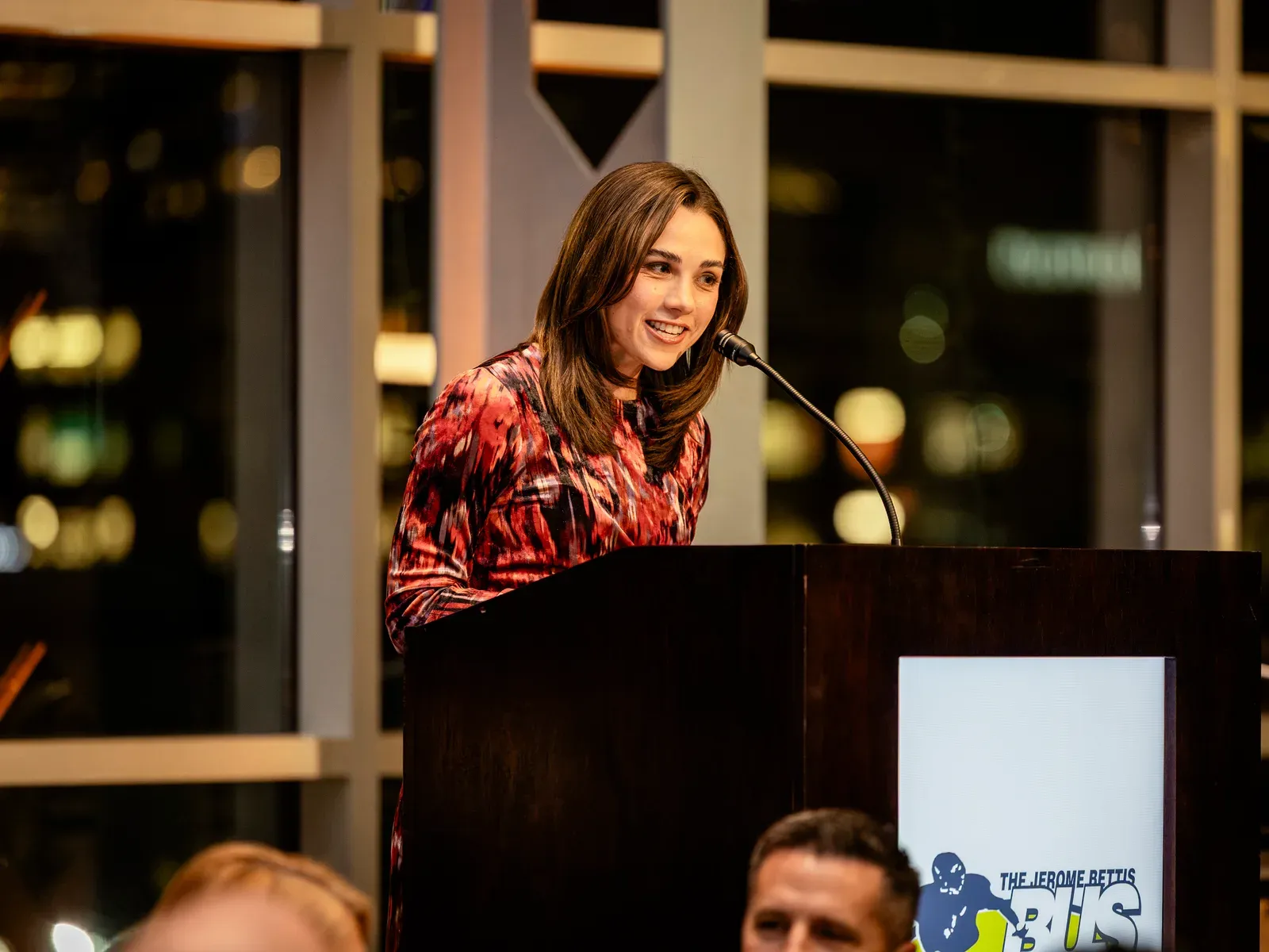 A speaker addressing the room at the Caring for Kids Gala